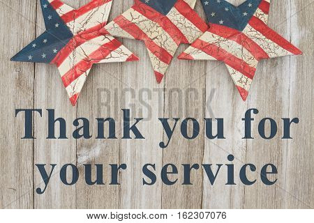 USA patriotic thank you message USA patriotic old flag on a stars with weathered wood background with text Thank you for your service