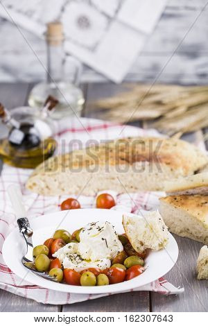 Italian focaccia bread with olives and basil
