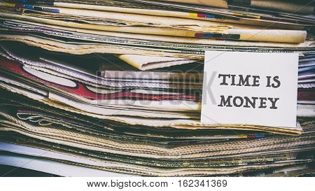 A Stack Of Old Newspapers, Words On A Paper Sticker