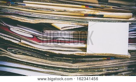A Stack Of Old Newspapers, Words On A Paper Sticker