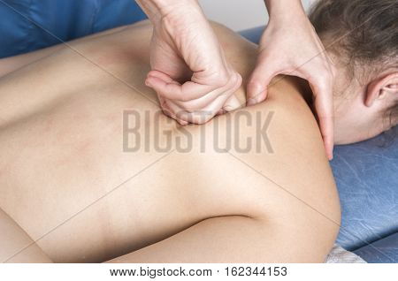 Physiotherapist, Chiropractor Giving A Massage And Stretching Of Subscapularis And Rhomboid