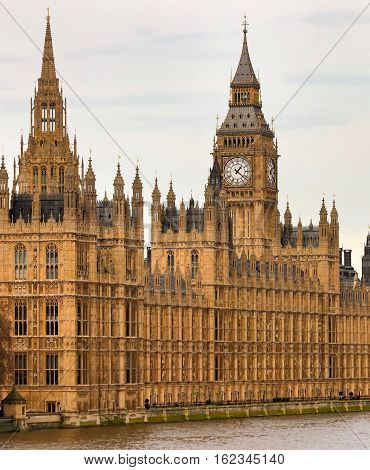 A view of Westminster in London with Big Ben and the river themes.