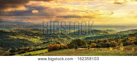 Maremma sunset panorama. Countryside hills and sea on horizon. Val di Cecina Livorno coast Tuscany Italy Europe