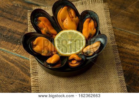Delicius appetizer with natural mussels and lemon