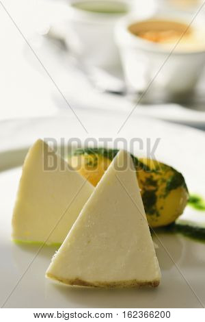 closeup of some pieces of majorero cheese from Fuerteventura, Spain, on a white ceramic plate, on a table