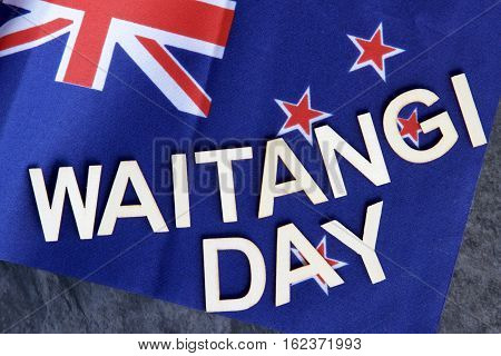 Waitangi or (Independence Day) signage on a New Zealand flag.