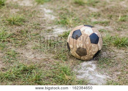 Old  ball football on grass , tream sport