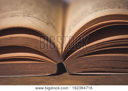 Old book shot with a single incandescent light source