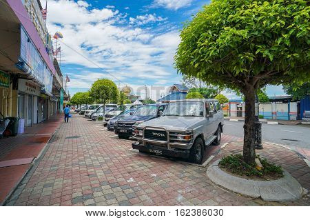 Labuan,Malaysia-May 3,2016:Carpark in the street of Labuan,Malaysia.Labuan island having problem with parking space due to limited space & many new cars in the Labuan island road due to duty-free cars