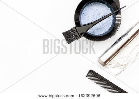Tools for hair dye and hairdye top view on white background