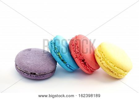 Colorful macarons on white background. Macaron is sweet meringue-based confection