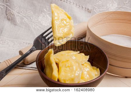 Close Up View Of Boiled Varenyky Or Dumpling With Cottage Cheese Or Curd On Metal Fork. Fresh Boiled