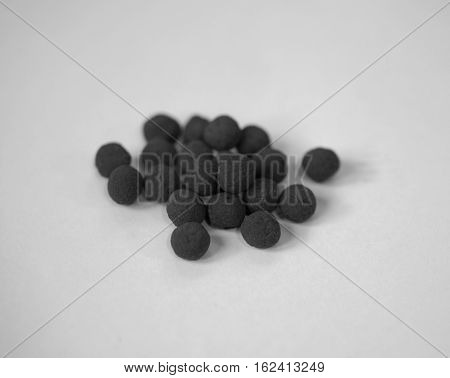 BLACK AND WHITE PHOTO OF TURMERIC BALLS