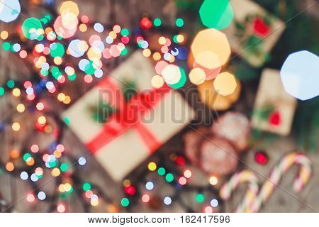 Christmas card. Christmas Cookies Chocolate gifts tangerines candy on blur light background. Xmas and Happy New Year composition. Top view. Selective focus. Toning