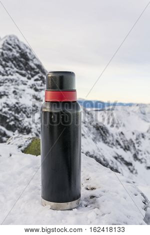 Winter And Thermos In The Mountains.