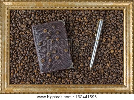 Coffee bean Notepad pen frame from the picture beautiful background view from the side. Business concept.