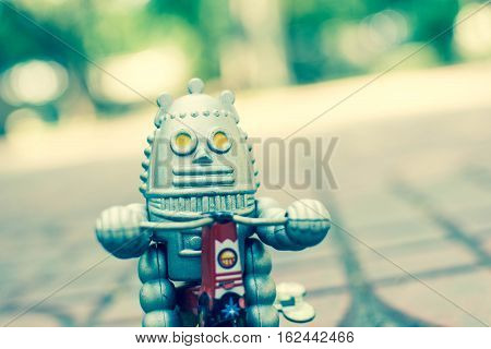 Retro robot toy, vintage color style, vintage tone background.