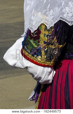 CAGLIARI, ITALY - October 29, 2016: Invitas, waterfront Porto, Sardinia traditions, performances and food. - Detail of a female traditional Sardinian costumes