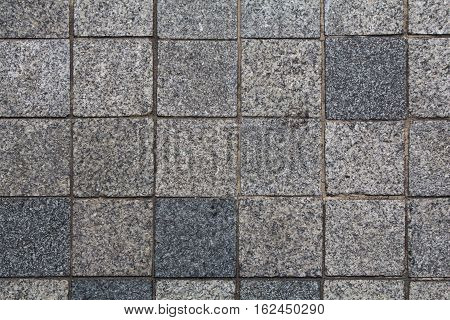 Stone wall from small pieces in gray color