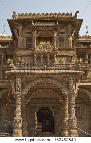 AHMADABAD, INDIA - OCTOBER 30, 2007: Ornately carved stonework of the entrance to the Hutheesing Temple in Ahmadabad, Gujarat, India. Jain temple built circa 1848.