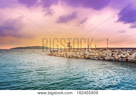 Sunset with colorful sky at rock pier Khao leam ya National park Rayong Province Thailand