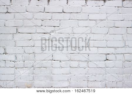 The old masonry of brick painted white