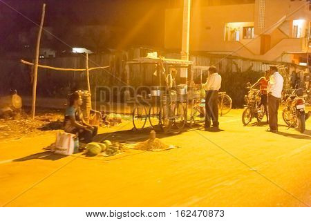 Illustrative image. Pondicherry, Tamil Nadu, India - Marsh 10, 2014. Village and city by night in India area. Life during the night.