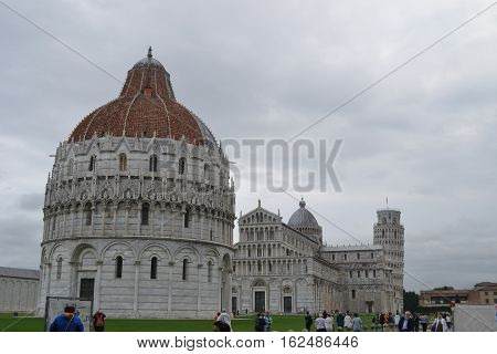 Leaning Tower of Pisa stands behind  Pisa Cathedral