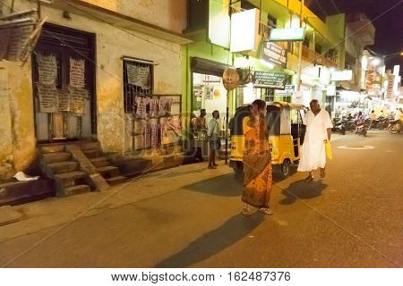 Illustrative image. Pondicherry, Tamil Nadu, India - Marsh 10, 2014. Village and city by night in India area. Life during the night.