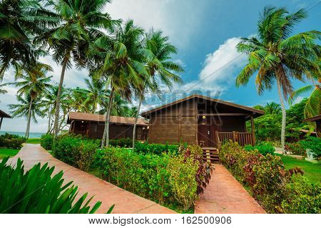 Cayo Guillermo island, Sercotel resort, Cuba, July 4, 2016, beautiful inviting gorgeous view of a bungalow house standing above the ground in front of the beach with ocean view on slightly cloudy day