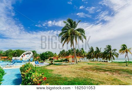 Cayo Guillermo island, Sercotel resort, Cuba, July 4, 2016, nice amazing gorgeous landscape view of hotel grounds with swimming pool and people relaxing and enjoying their time on sunny day