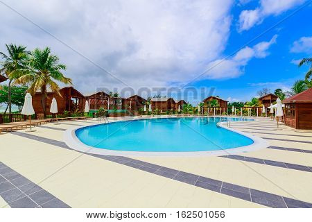 Cayo Guillermo island, Sercotel club resort, Cuba, July 4, 2016, beautiful inviting gorgeous, stunning view of hotel grounds with cozy, comfortable swimming pool located near the beach area on sunny day
