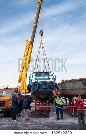 MOSCOW, RUSSIA - NOVEMBER 11, 2016: State Unitary Enterprise Mosvodostok performs recovery vessels on coastal winter parking. The ship is set on the beach.
