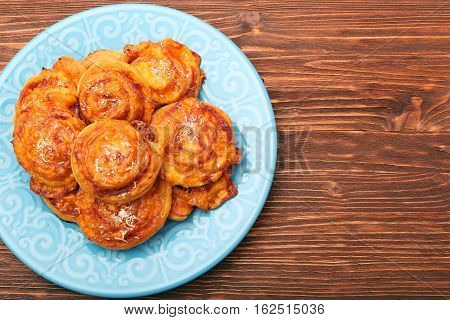 Puff pastry rolls with ham and cheese. Food for parties. Snack.