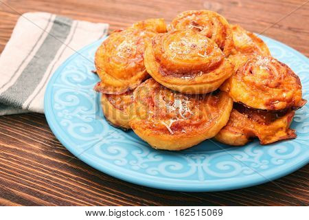 Puff pastry rolls with ham and cheese. Food for parties. Snack.