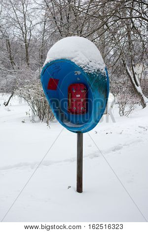old broken pay phone, in the snow