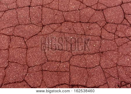 Red Toned Damaged Asphalt Texture.