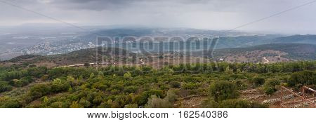View of the Jezreel Valley in fog in winter cloudy day from Muhraqa on Mount Carmel in Lower Galilee Israel
