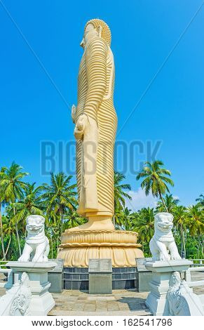 The white lions on the bridge leading to the Tsunami Memorial Statue of Buddha in Peraliya Sri Lanka.