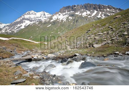 View of two summits (Grande Casse and Pierre Brune) from a torrent in Vanoise National Park, French Alps, France