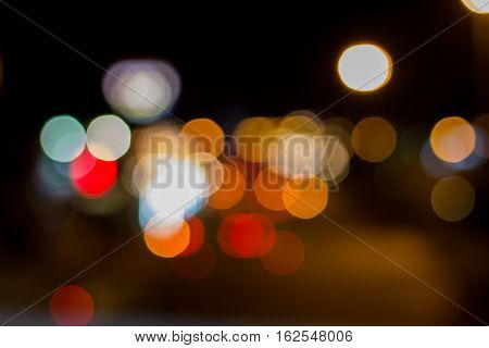Abstract light bokeh on night street used as background