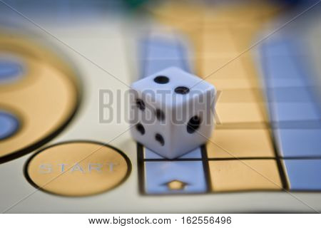 Die on the board with motion blur zoom effect.