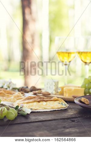 Сheese pie strudel with cheese cheese pie 4. Wine grapes nuts cheese blue cheese and coffee. dinner lunch romantic date picnic eating on nature.
