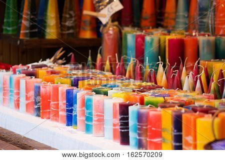 multicolored handmade candles of various shapes and sizes