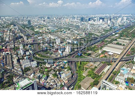 BANGKOK, THAILAND - MAY 1, 2014. Bangkok skyline during daytime shooting from Baiyok Sky 81th floor with Showing complicated ring of expressways and mains roads of Bangkok