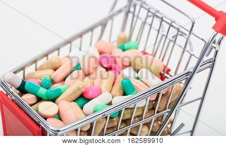 Trolley Full Of Pills On White Background