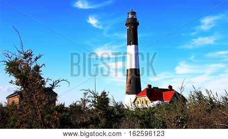 The Fire Island Lighthouse with a deep blue sky