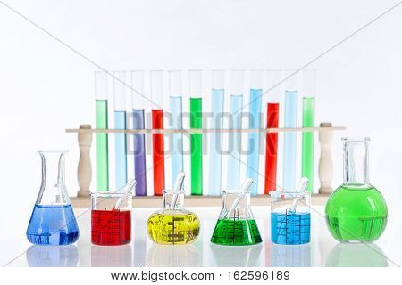 Various laboratory flasks with a colored reagents,