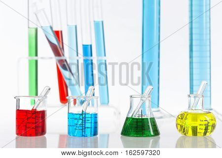 Various laboratory flasks with a colored reagents,