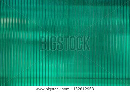 Green plastic sheet of polycarbonate on the building